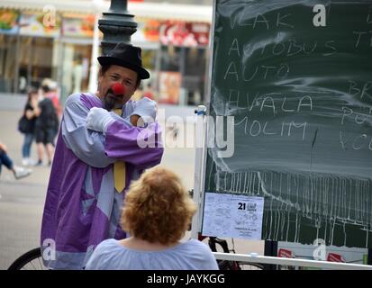 ZAGREB - MAY 2017 : Cest is d`Best famous street festival with many performers on May 2017 in Zagreb. Clown performer doing his performance play teach Stock Photo